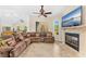 A comfortable living room featuring fireplace, large windows, and tile flooring at 6005 Bancroft Blvd, Orlando, FL 32833