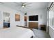 Cozy bedroom with ensuite bathroom access, soft carpet, and a stylish dresser at 6117 Sandy Springs Ct, St Cloud, FL 34771