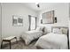 Charming bedroom with two twin beds, neutral decor, and a window that brings in natural light at 6117 Sandy Springs Ct, St Cloud, FL 34771