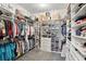 Spacious walk-in closet with custom shelving and ample storage space for clothing and accessories at 6117 Sandy Springs Ct, St Cloud, FL 34771