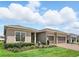 Beautiful single-story home with well-kept landscaping, a paver driveway, and a charming exterior at 6117 Sandy Springs Ct, St Cloud, FL 34771