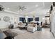 Spacious living room featuring an open layout, modern decor, and access to kitchen and dining areas at 6117 Sandy Springs Ct, St Cloud, FL 34771