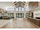 Grand lobby area featuring a soaring beamed ceiling, reception desk, and seating area at 6117 Sandy Springs Ct, St Cloud, FL 34771