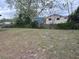Backyard with large grassy area and fence at 6567 Magee Ct, Orlando, FL 32818