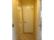 Hallway with tile flooring and doorways leading to various rooms in the home at 6567 Magee Ct, Orlando, FL 32818