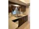Kitchen with double basin sink and wood cabinetry at 6567 Magee Ct, Orlando, FL 32818