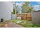 Fenced backyard featuring a weathered bench, small storage shed, and concrete patio at 713 Saint Matthew Cir, Altamonte Springs, FL 32714