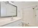 Bathroom featuring white vanity, mirror, modern faucet, toilet, and walk-in shower at 713 Saint Matthew Cir, Altamonte Springs, FL 32714