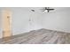 Bedroom featuring light wood floors, ceiling fan, ensuite bathroom, and closet at 713 Saint Matthew Cir, Altamonte Springs, FL 32714