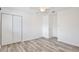 Bedroom with light wood floors, ceiling fan, closet, and fresh white walls at 713 Saint Matthew Cir, Altamonte Springs, FL 32714