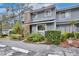 Charming townhouse with well-maintained landscaping and brick architectural details at 713 Saint Matthew Cir, Altamonte Springs, FL 32714