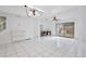 Spacious living area with tile flooring, storage cabinet and sliding glass doors at 713 Saint Matthew Cir, Altamonte Springs, FL 32714