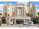 Grand resort entrance featuring stately columns and a circular drive at 7807 Loxahatchee Ct, Reunion, FL 34747