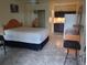 A bedroom space with a double bed, closet and kitchenette at 7900 S Orange Blossom Trl # 2052, Orlando, FL 32809