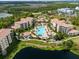 Aerial view of resort-style pool and common area landscaping, and surrounding condos at 8763 Worldquest Blvd # 5306, Orlando, FL 32821