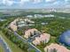 Beautiful aerial view of condos with lush landscaping, ponds, and convenient parking at 8763 Worldquest Blvd # 5306, Orlando, FL 32821