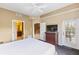 Bright bedroom with a ceiling fan and balcony access, offers a relaxing retreat at 8763 Worldquest Blvd # 5306, Orlando, FL 32821