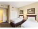 Inviting bedroom with two beds, soft lighting, and stylish decor at 8763 Worldquest Blvd # 5306, Orlando, FL 32821