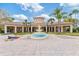 Beautiful clubhouse featuring a central fountain and ample outdoor seating and recreation at 8763 Worldquest Blvd # 5306, Orlando, FL 32821