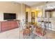Open concept dining area with seating for six, blends into the living space at 8763 Worldquest Blvd # 5306, Orlando, FL 32821