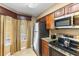 Well-equipped kitchen features stainless steel appliances and granite countertops for a modern touch at 8763 Worldquest Blvd # 5306, Orlando, FL 32821