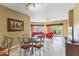 Spacious living room features a dining area, balcony access and comfortable furnishings at 8763 Worldquest Blvd # 5306, Orlando, FL 32821