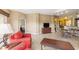 Open-concept living space featuring a dining area, television, and neutral color scheme at 8763 Worldquest Blvd # 5306, Orlando, FL 32821