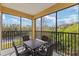 Screened patio featuring outdoor dining table and beautiful nature view at 8763 Worldquest Blvd # 5306, Orlando, FL 32821
