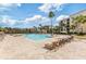 Resort-style pool with plenty of lounge seating and palm trees, perfect for relaxation at 8763 Worldquest Blvd # 5306, Orlando, FL 32821