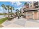 Community Tiki Bar with tables and lounge chairs near the pool and condo buildings at 8763 Worldquest Blvd # 5306, Orlando, FL 32821
