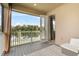 Covered outdoor balcony with seating and scenic views of the lake and wooded landscape at 889 Terrapin Dr, Debary, FL 32713