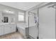 Bright bathroom with shower, bathtub, and white double sink vanity with plenty of counter space at 889 Terrapin Dr, Debary, FL 32713