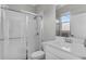 Clean bathroom featuring white tile, a glass-enclosed shower, and a white vanity at 889 Terrapin Dr, Debary, FL 32713