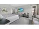 Bright bedroom with modern furniture and large windows, offering a comfortable and stylish living space at 889 Terrapin Dr, Debary, FL 32713