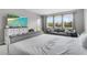 Well-lit bedroom featuring large windows and comfortable furniture, creating a cozy and inviting retreat at 889 Terrapin Dr, Debary, FL 32713