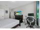 Bedroom featuring a bed, TV, and desk area; carpeted in neutral gray at 889 Terrapin Dr, Debary, FL 32713