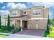 Stunning two-story home boasts a charming facade with a two-car garage and manicured landscaping at 889 Terrapin Dr, Debary, FL 32713