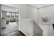 Upstairs hallway with hardwood flooring and a view into the living area, providing seamless flow at 889 Terrapin Dr, Debary, FL 32713