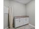 Well-lit laundry area with cabinets, countertop, and neutral design elements at 889 Terrapin Dr, Debary, FL 32713