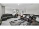 Spacious living area featuring modern furnishings, stylish rug, and neutral color scheme, creating an inviting atmosphere at 889 Terrapin Dr, Debary, FL 32713