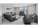 Comfortable living room with plush seating, a large rug, and a wall-mounted TV, perfect for relaxation at 889 Terrapin Dr, Debary, FL 32713