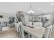 Dining room view into kitchen with stairs to second floor and living room at 889 Terrapin Dr, Debary, FL 32713