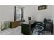 Functional office space with a large desk, storage, and a comfortable chair, perfect for remote work at 889 Terrapin Dr, Debary, FL 32713