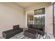 Screened patio with wicker seating and view of home's interior at 889 Terrapin Dr, Debary, FL 32713