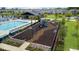 Elevated view of a playground, pool, and outdoor common space at 889 Terrapin Dr, Debary, FL 32713