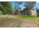 Expansive backyard featuring a screened-in patio, offering ample space for outdoor living and entertaining at 901 Dorset Pl, Davenport, FL 33896