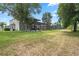Large backyard with a screened-in patio, perfect for relaxing and enjoying the outdoors at 901 Dorset Pl, Davenport, FL 33896