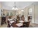 Formal dining room with natural lighting flowing into living room, offering a spacious area for entertaining and gathering at 901 Dorset Pl, Davenport, FL 33896