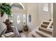 Welcoming foyer with staircase and decorative accents, setting a warm tone for the home's interior at 901 Dorset Pl, Davenport, FL 33896