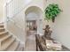 Charming foyer with stairway, leading to living spaces, enhanced with elegant decorative elements at 901 Dorset Pl, Davenport, FL 33896